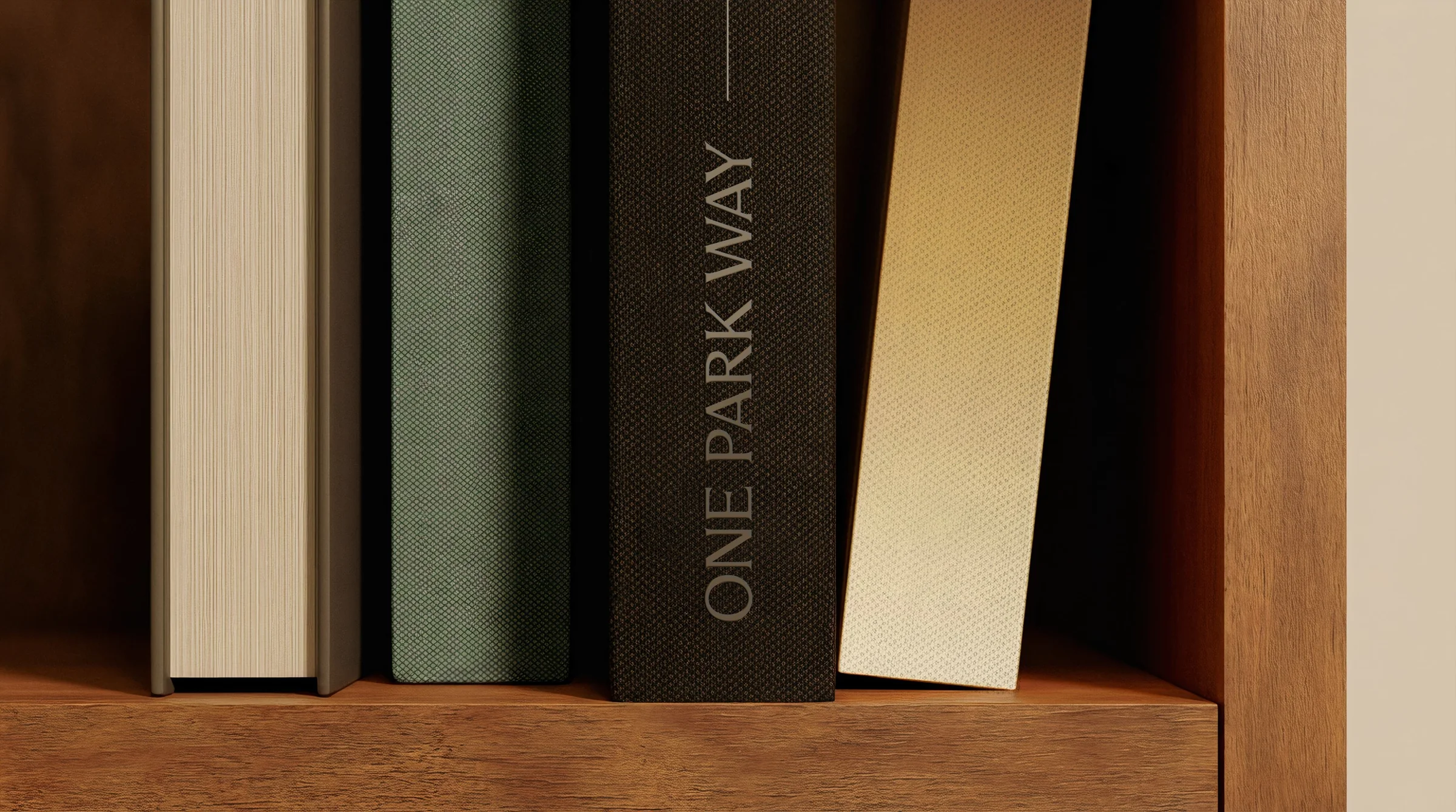 One Park Way book spines — embossed wordmark on shelf