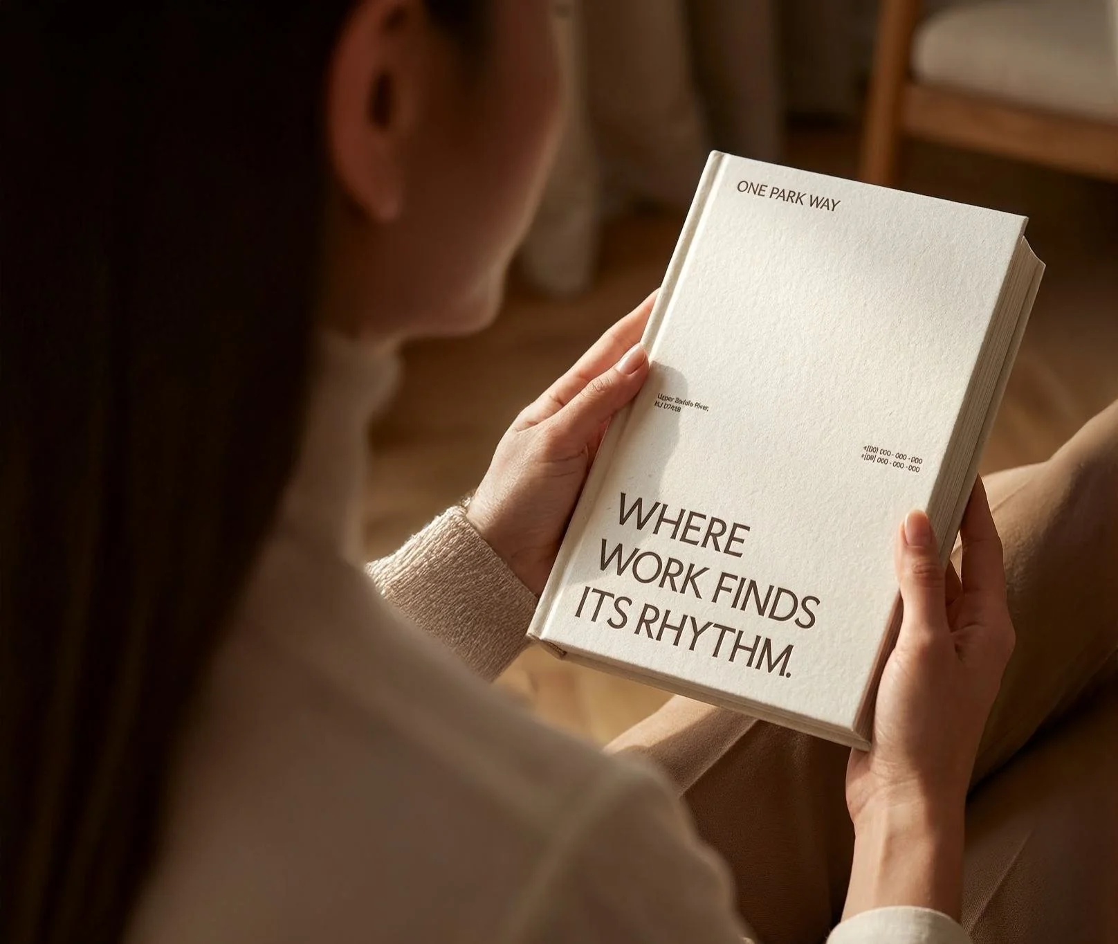 One Park Way book held — Where work finds its rhythm cover