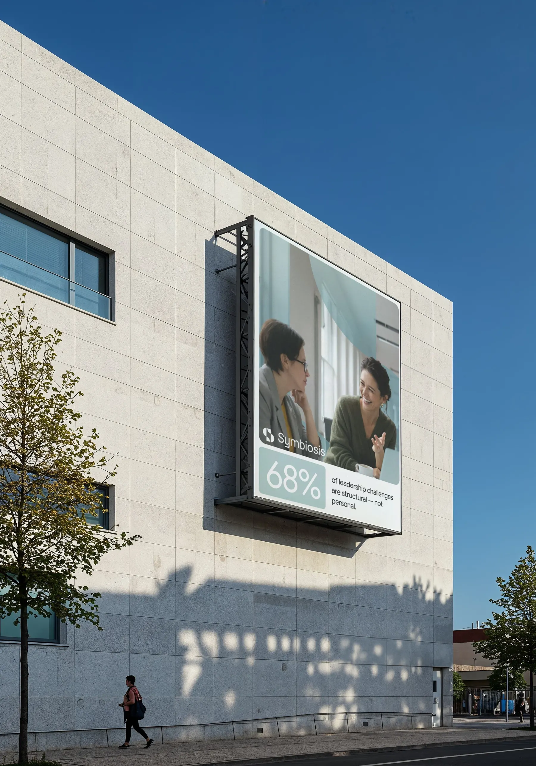 Symbiosis Advisors billboard — 68% of leadership challenges are structural, not personal